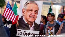 A protester carries a photo of Mexican President AndrÃ©s Manuel Lopez Obrador with the words, Te quÃ©remos (We love you) during a march celebrating the summit of President LÃ³pez Obrador with President Joe Biden and Canadian Prime Minister Justin Trudeau. Demonstrators are demanding immigration reform while also cheering on the Mexican president. (Photo by Allison Bailey/NurPhoto)