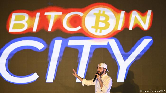 El Salvador's president, Nayib Bukele, talking in front of a Bitcoin background 