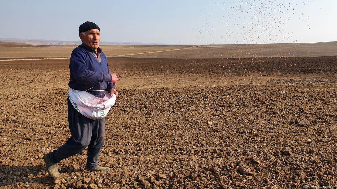 Turkish farmer Abdurrahman Durgun stands on a field