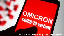 November 26, 2021, Ukraine: In this photo illustration, a phone screen shows a text that says Omicron COVID-19 variant. (Credit Image: © Pavlo Gonchar/SOPA Images via ZUMA Press Wire