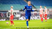 Florian Wirtz celebrates his goal for Bayer Leverkusen against RB Leipzig