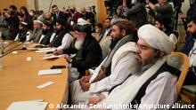 Members of political delegation from the Afghan Taliban's movement attend talks involving Afghan representatives in Moscow, Russia, Wednesday, Oct. 20, 2021. Russia invited the Taliban and other Afghan parties for talks voicing hope they will help encourage discussions and tackle Afghanistan's challenges. (AP Photo/Alexander Zemlianichenko, Pool)
