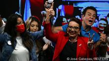 Xiomara Castro, presidential candidate of the Liberty and Refoundation Party (LIBRE), and vice presidential candidate Salvador Nasrala react after the closing of the general election in Tegucigalpa, Honduras, November 28, 2021. REUTERS/Jose Cabezas