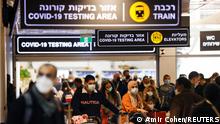 28.11.21 *** Travellers exit the coronavirus disease (COVID-19) pandemic testing area at Ben Gurion International Airport as Israel imposes new restrictions near Tel Aviv, Israel November 28, 2021. REUTERS/Amir Cohen