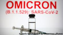November 26, 2021, Ukraine: In this photo illustration, a medical syringe and a vial are seen in front of the text Omicron (B.1.1.529): SARS-CoV-2 in the background. (Credit Image: © Pavlo Gonchar/SOPA Images via ZUMA Press Wire