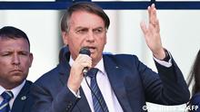 Brazilian President Jair Bolsonaro delivers a speech to supporters in Brasilia after joining the right-wing Liberal Party (PL) on November 30, 2021, to seek reelection in the October 2022 polls. - Bolsonaro joined the PL to seek reelection in the October 2022 polls, despite not announcing his candidacy yet. Bolsonaro, who has been without a political party since 2019, was required to join one to run for the presidency as Brazilian laws bar independent candidacies. (Photo by EVARISTO SA / AFP)