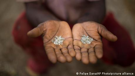Miner in Brazil cupping diamonds in palms