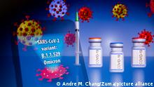 November 27, 2021, Asuncion, Paraguay: Illustration: In-camera multiple exposure image shows the words SARS-CoV-2 variant: B.1.1.529 Omicron on a smartphone in front of visual representation of virus, medical syringe and ampoules labeled COVID-19. The World Health Organization (WHO) has designated the SARS-CoV-2 variant: B.1.1.529 as a Variant of Concern (VOC), named Omicron. (Credit Image: Â© Andre M. Chang/ZUMA Press Wire
