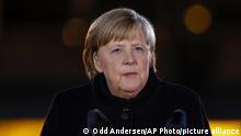 German Chancellor Angela Merkel makes a speech at the Defence Ministry during the Grand Tattoo (Grosser Zapfenstreich), a ceremonial send-off for her, in Berlin on Thursday, Dec. 2, 2021. (Odd Andersen/Pool Photo via AP)