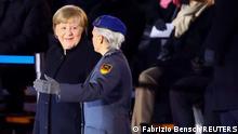 Germany's outgoing Chancellor Angela Merkel attends a Grand Tattoo of the German armed forces Bundeswehr at the Defence Ministry in Berlin, Germany, December 2, 2021. REUTERS/Fabrizio Bensch