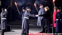 BERLIN, GERMANY - DECEMBER 02: Outgoing German Chancellor Angela Merkel attends her military tattoo ceremony hosted by the Bundeswehr on December 02, 2021 in Berlin, Germany. Merkel will be stepping down soon to make way for German Social Democrat (SPD) Olaf Scholz, who will lead a coalition government of SPD, Greens and German Free Democrats (FDP).(Photo by Friedemann Vogel - Pool/Getty Images)