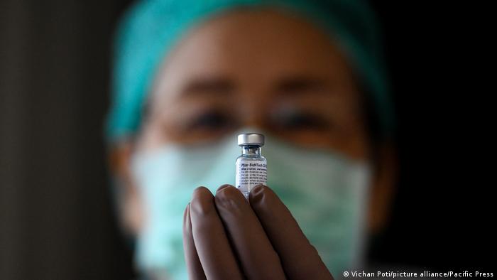 Thai medical official looks on the COVID-19 Pfizer vaccine