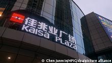 --FILE--A signboard of Kaisa Plaza of Kaisa Group Holdings Limited in Dalian city, northeast China's Liaoning province, 10 June 2018. Most founding bosses in the realty business hold total sway over their companies, especially in strategy. In top companies like Evergrande Real Estate Group and Country Garden Holdings, the bosses oversee strategy while presidents execute their instructions and manage daily operations. Bosses°Ø short-term absences generally do not affect company operations, but if the owner is away too long this may inflict severe harm as the realty business is capital-intensive and debt-riddled, while most loan contracts contain mandatory provisions such as the °∞Owner or his/her family members must serve as the chairman of the board and exercise absolute control over the company.°±