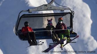 Three skiers on the lift