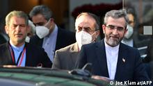 Iran's chief nuclear negotiator Ali Bagheri Kani (R) and members of his delegation are seen leaving the Coburg Palais, venue of the Joint Comprehensive Plan of Action (JCPOA) meeting aimed at reviving the Iran nuclear deal, in Vienna on December 3, 2021. - Negotiations in Vienna aimed at reviving the Iran nuclear deal are to be suspended on December 3 so that European diplomats can review proposals by the Islamic republic, state media said. The talks would most likely resume on December 6 but the negotiating teams would need to remain in the Austrian capital to continue their work, the semi-official ISNA news agency said. (Photo by JOE KLAMAR / AFP)