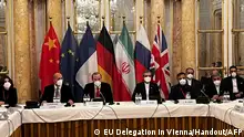 This handout photo taken and released on December 3, 2021 by the EU delegation in Vienna shows representatives from Iran (R) and the European Union (L) attending a meeting of the joint commission on negotiations aimed at reviving the Iran nuclear deal in Vienna, Austria. - Negotiations in Vienna aimed at reviving the Iran nuclear deal are to be suspended on December 3 so that European diplomats can review proposals by the Islamic republic, state media said. The talks would most likely resume on December 6 but the negotiating teams would need to remain in the Austrian capital to continue their work, the semi-official ISNA news agency said. (Photo by Handout / EU DELEGATION IN VIENNA / AFP) / RESTRICTED TO EDITORIAL USE - MANDATORY CREDIT AFP PHOTO / EU DELEGATION IN VIENNA - NO MARKETING - NO ADVERTISING CAMPAIGNS - DISTRIBUTED AS A SERVICE TO CLIENTS