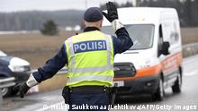 06.04.2020 Police controls drivers on a road in Lapinjärvi, Finland, on April 6, 2020 as the Finnish army has set up roadblocks on all routes that connect Helsinki (Uusimaa region) with the rest of the country to prevent people from travelling and spreading the novel coronavirus. (Photo by Heikki Saukkomaa / Lehtikuva / AFP) / Finland OUT (Photo by HEIKKI SAUKKOMAA/Lehtikuva/AFP via Getty Images)