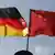 The German and Chinese flags side by side