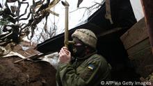 TOPSHOT - A Ukrainian serviceman stands guard at a position on the frontline with Russia backed separatists near small city of Marinka, Donetsk region on April 12, 2021. - Ukrainian soldiers have been killed in clashes with pro-Russia separatists in Ukraine's war-torn east, its military said on April 12, 2021, as Kiev again accused Moscow of massing tens of thousands of soldiers on its border. (Photo by STR / AFP) (Photo by STR/AFP via Getty Images)