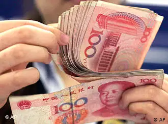 In this photo taken on Aug. 25, 2010, a bank clerk counts Chinese 100 Yuan notes in Shanghai. China's currency advanced to a fresh high against the U.S. dollar for the second straight day on Tuesday, Sept. 14, 2010 as U.S. lawmakers prepared for hearings on Beijing's foreign exchange policies. (AP Photo/Eugene Hoshiko)