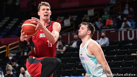 Moritz Wagner shields the ball from Luka Doncic 