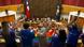 People applaud holding a rainbow flag in Chile's congress building People applaud holding a rainbow flag in Chile's congress building