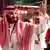 Saudi Arabia's crown prince Mohammed bin Salman smiles and waves