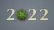 The year 2022 written out, with the 0 replaced by a representation of the COVID virus The year 2022 written out, with the 0 replaced by a representation of the COVID virus