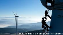 IZMIR, TURKEY - FEBRUARY 19: Rope access technicians carry out maintenance service on wind turbines including repairs, blade inspections and cleaning in Izmir, Turkey on February 19, 2021. In Turkey, where investments in renewable energy has increased, there are wind tribunes over 3,500. Turbines, where huge cranes and high platforms are used during the installation phase, require routine maintenance and repair work in certain periods. Technicians, who arrive at the wind park, stop the turbines to be maintained and repaired and the field mission of rope access technicians begins. The work of crews descending from a height of approximately 100 meters to perform maintenance and repair work take approximately 1 hour on each wing. Mahmut Serdar Alakus / Anadolu Agency