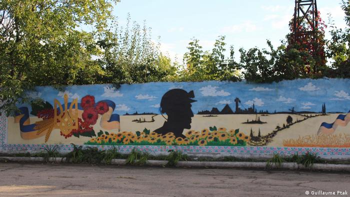 A mural painting honouring the miners of Zolote. 