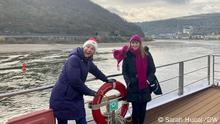 03/12/2021 DW reporter Sarah Hucal and her mom Deborah Hucal took a riverboat cruise for 3-nights at the start of December. Alt-text: Deborah Hucal and Sarah Hucal stand on the deck of a boat with a view of the Rhine river in the background
