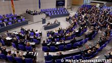 German members of parliament vote during the plenary session in the German lower house of parliament Bundestag, in Berlin, Germany, December 10, 2021. REUTERS/Michele Tantussi