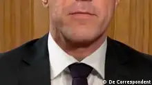 Mark Rutte's mouth and in a suit