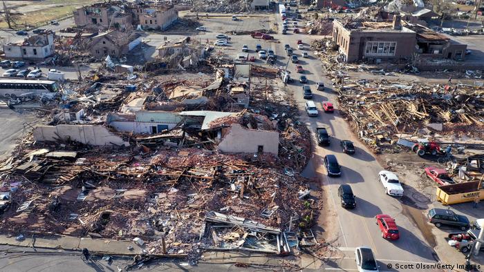 In this aerial view, homes and businesses are destroyed after a tornado ripped through town the previous evening on December 11, 2021 in Mayfield, Kentucky.