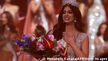 Miss India, Harnaaz Sandhu, is crowned Miss Universe during the 70th Miss Universe beauty pageant in Israel's southern Red Sea coastal city of Eilat on December 13, 2021. (Photo by Menahem KAHANA / AFP) (Photo by MENAHEM KAHANA/AFP via Getty Images)
