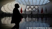 13.12.2021
A man walks inside the Beijing Olympic Tower in Beijing, host of the 2022 Winter Olympic Games, on December 13, 2021. (Photo by Noel Celis / AFP) (Photo by NOEL CELIS/AFP via Getty Images)