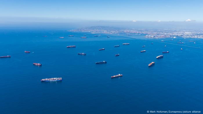 An aerial photo of container ships waiting to get into the Port of Los Angeles and Long Beach to unload