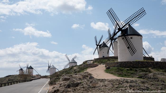 old windmills grouped on the crest of a ridge