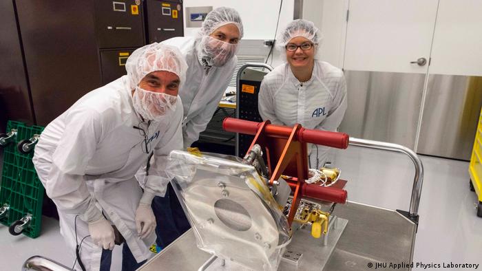 From left to right: Chris Scholz (University of California, Berkeley), Tony Case (Smithsonian Astrophysical Observatory), and NASA Program Scientist Kelly Korreck with the Solar Wind Electrons Alphas and Protons (SWEAP) cup just before it was integrated onto Parker Solar Probe
