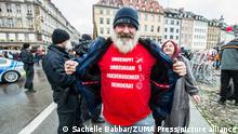 November 28, 2021, Munich, Bavaria, Germany: A man proudly displays being unvaccinated. Despite southern Bavaria being in the clutches of a brutal fourth wave and beingnonnthe cusp of a Delta and Omicron Winter, Corona deniers from throughout Germany banded together without respecting any of the infection control regulations to memorialize disgraced former police officer and conspiracy theorist Karl Hilz who died after being reported by those in his circles as a ''pneumonia''. Since Hilz's death, numerous grifters from the Querdenker scene with little to no connection to him have claimed knowing him and have even tried to raise funds in his name. (Credit Image: Â© Sachelle Babbar/ZUMA Press Wire