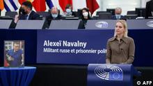 The Daughter of Russian opposition leader Alexei Navalny, Daria Navalnaya (L) delivers a speech after receiving the Sakharov prize on her father's behalf during the Award ceremony of the Sakharov Prize at the European Parliament in Strasbourg on December 15, 2021. (Photo by Julien WARNAND / POOL / AFP)