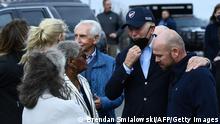 US President Joe Biden (C) tours Mayfield, Kentucky, with (L-R) Mayor of Kathy O'Nan, Bishop Anne Henning Byfield, and Graves County Judge Executive Jesse Perry on December 15, 2021, after the city was devastated by the December 10-11 tornadoes, (Photo by Brendan Smialowski / AFP) (Photo by BRENDAN SMIALOWSKI/AFP via Getty Images)