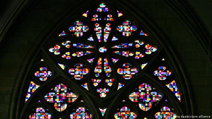 A display of colorful squares in a church window.