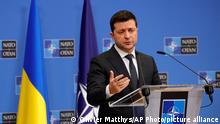 Ukraine's President Volodymyr Zelenskyy speaks as he participates in a media conference with NATO Secretary General Jens Stoltenberg at NATO headquarters in Brussels, Thursday, Dec. 16, 2021. (AP Photo/Olivier Matthys)