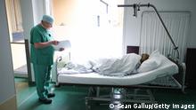 A woman lying in a bed in a hospital after undergoing an abortion procedure in Prenzlau, Germany
