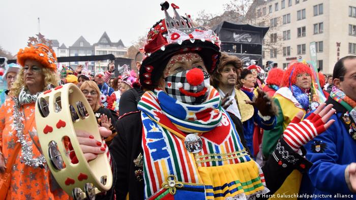 People in costumes celebrating Carnival in Cologne, Germany