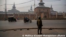 An Indian paramilitary soldier guards outside the Jamia Masjid, or the grand mosque in Srinagar, Indian controlled Kashmir, Nov. 26, 2021. The mosque has remained out of bounds to worshippers for prayers on Friday – the main day of worship in Islam. Indian authorities see it as a trouble spot, a nerve center for anti-India protests and clashes that challenge New Delhi’s sovereignty over disputed Kashmir. For Kashmiri Muslims it is a symbol of faith, a sacred place where they offer not just mandatory Friday prayers but also raise their voice for political rights. (AP Photo/Mukhtar Khan)