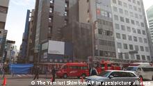 A picture shows a fire site in Osaka City, Osaka Prefecture on Dec. 17, 2021. An about 20-square-meter clinic on the fourth floor was burnt. According to City Fire Station, 27 people are in cardiopulmonary arrest. ( The Yomiuri Shimbun via AP Images )