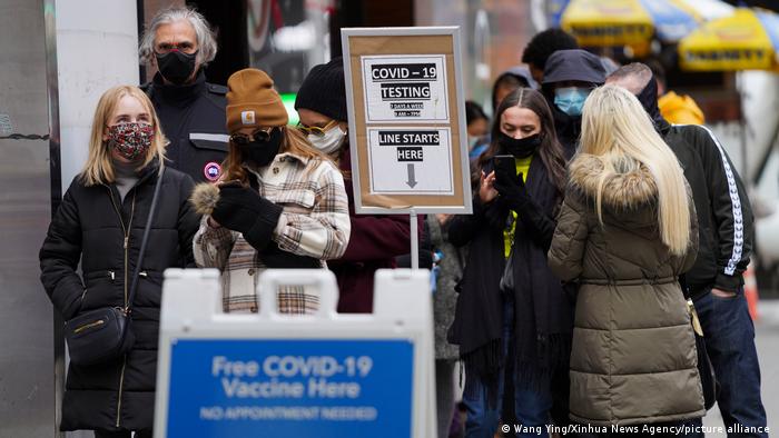 People line up at COVID-19 vaccination and testing center in New York