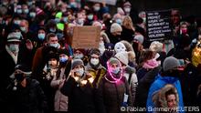 People take part in a demonstration against coronavirus disease (COVID-19) measures, in Hamburg, Germany December 18, 2021. REUTERS/Fabian Bimmer
